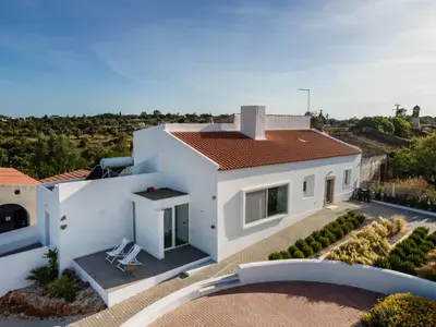 an aerial view of a white house with a roof at Casa Monte dos Entrudos in Almancil