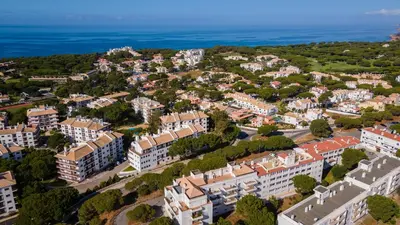 an aerial view of a city with buildings and the ocean at Sun House by LovelyStay in Albufeira