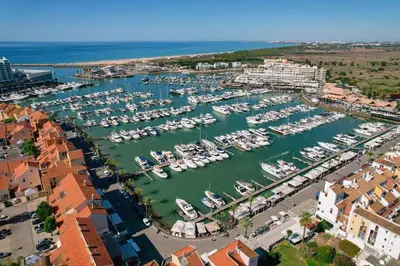 an aerial view of a marina with boats in the water at Centralgarve - Elegant and Cosy Studio in the Heart of Vilamoura - Aldeia do Mar T0 in Vilamoura