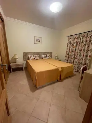 a bedroom with a large bed in a room at Lovely 2 Bedroom Home inside a Resort in Albufeira in Albufeira