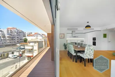 a kitchen and dining room with a view of a city at Albufeira Prime 1B - Dream Lodging in Albufeira