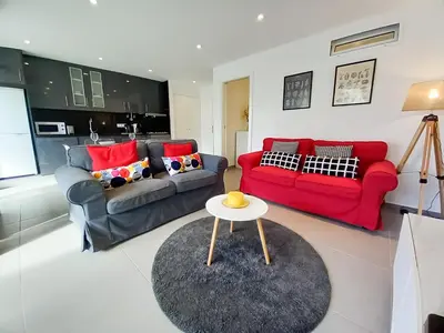 a living room with two couches and a table at T2 Tenis Golf Mar in Vilamoura