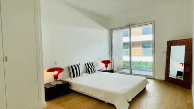 a bedroom with a bed and a large window at Prime by Check-in Portugal in Albufeira