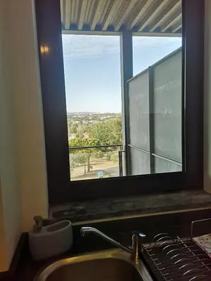 a kitchen with a sink and a window with a view at RESIDENCE GOLF CLUB 415 in Quarteira