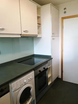 a kitchen with a washing machine in a kitchen at RESIDENCE GOLF CLUB 415 in Quarteira