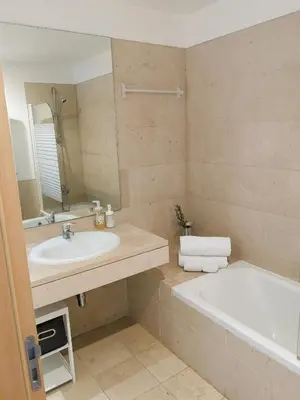 a bathroom with a sink and a bath tub at RESIDENCE GOLF CLUB 415 in Quarteira