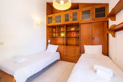 a framed picture of the beach on a wall at #047 Families Only - Almond Tree by Home Holidays in Albufeira