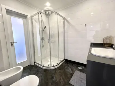 a bathroom with a shower and a sink at Topazio - Pool & near the center by HD PROPERTIES in Vilamoura