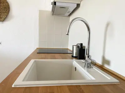 a white sink in a kitchen next to a counter at Panoramic Seaview - 2 Bedroom, Main Ave, 15 Min Walk Beach, Workspace in Albufeira