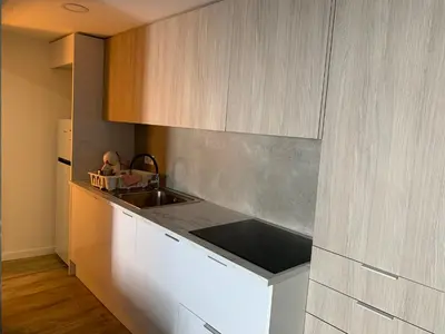 a kitchen with a sink and a counter top at CASA DAS CEGONHAS in Faro