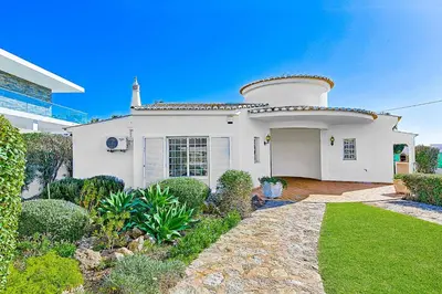 a white house with a turret on top of it at Casa Palmeira in Terras Novas