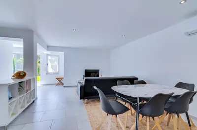 a living room with a table and chairs at AL - Barracuda Village in Vilamoura