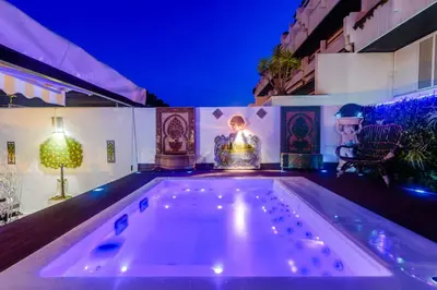 a bath tub with a candle in the middle of a house at Marina Real - Sea View by HD PROPERTIES in Vilamoura