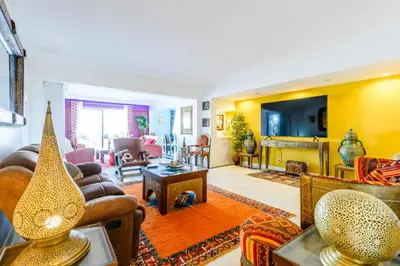 a living room with a couch and a table at Marina Real - Sea View by HD PROPERTIES in Vilamoura
