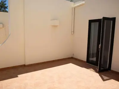 an empty room with a window and a door at Albufeira Sol Villas I by Stay ici Algarve Holiday Rental in Albufeira