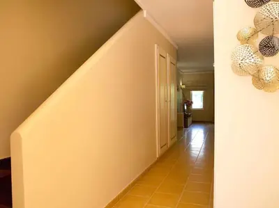 a hallway with a stairway with a staircase at Albufeira Sol Villas I by Stay ici Algarve Holiday Rental in Albufeira