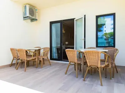 a dining room with a table and chairs at Albufeira Sol Villas I by Stay ici Algarve Holiday Rental in Albufeira