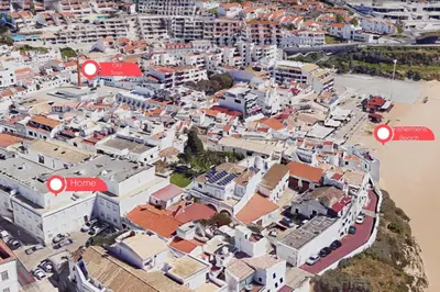 a bedroom with a bed with two lamps and a sign that says home holidays at #056 Old Post Office by Home Holidays in Albufeira