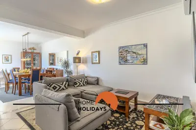 a dining room with a table and a window at #056 Old Post Office by Home Holidays in Albufeira