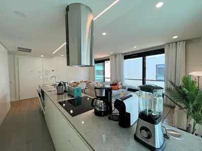 a kitchen with a counter with a blender on it at Faro Design 1 by Homing in Faro