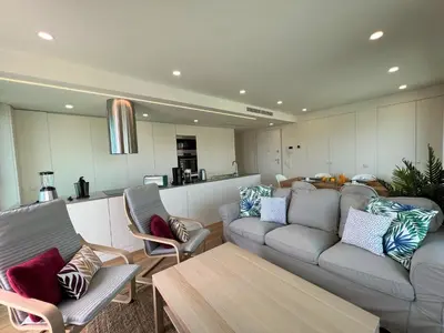 a living room with a couch and chairs and a table at Faro Design 2 by Homing in Faro