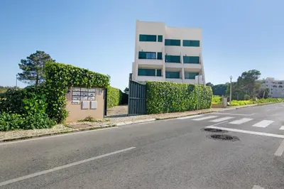 an empty street in front of a building at Casa dos Salgados in Albufeira