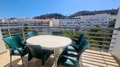 a table and chairs on a balcony with a view at Casa Old Town Splendida in Albufeira