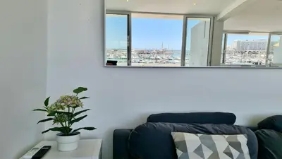 a living room with a couch and a mirror at Marina Algarve-CleverDetails, located on the marina close to all main amenities in Vilamoura