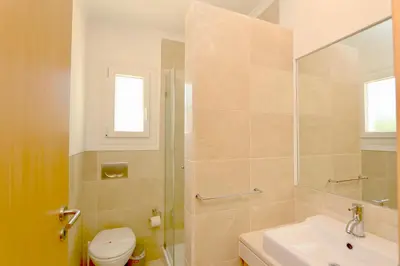 a bathroom with a toilet and a sink at Villa Bolivia-CleverDetails in Vilamoura