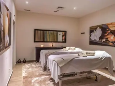 a bedroom with two beds and a fireplace at Albufeira Sol Villas III by Stay ici Algarve Holiday Rental in Albufeira