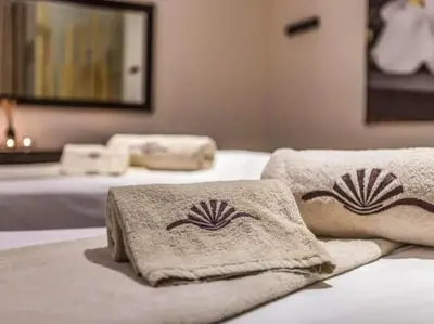 a bedroom with two beds with towels on them at Albufeira Sol Villas III by Stay ici Algarve Holiday Rental in Albufeira