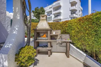 a swimming pool with lounge chairs and a swimming pool at Villa Alegre by Villa Plus in Albufeira