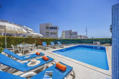 an aerial view of a city with white buildings at Villa Alegre by Villa Plus in Albufeira