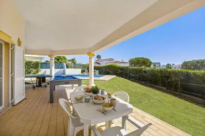 a swimming pool in the backyard of a house at Villa Casa Sophia by Villa Plus in Olhos de Água
