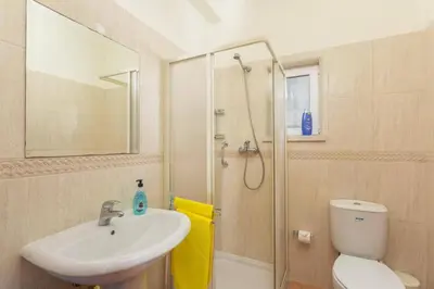 a bathroom with a sink and a toilet and a shower at Villa Casa Grande by Villa Plus in Albufeira