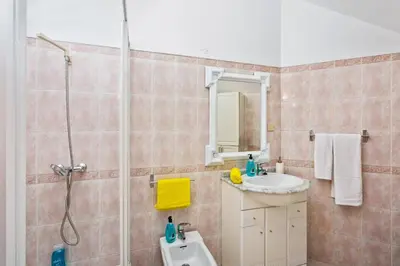 a bathroom with a shower and a sink at Villa Leonor by Villa Plus in Olhos de Água