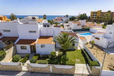 arial view of a villa with the ocean in the background at Villa Pina by Villa Plus in Albufeira