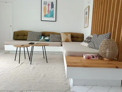 a living room with a couch and a table at Apartamento 90m2 com vista mar - Albufeira in Albufeira