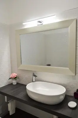 a bathroom with a large white sink and a mirror at BeGuest Feliz Choro Apartment in Branqueira