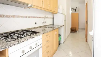 a kitchen with a sink and a stove at Apart Quinta dos Martins - swimming pool - BY BEDZY in Albufeira