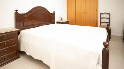 a bedroom with a bed with a white blanket on it at Apart Quinta dos Martins - swimming pool - BY BEDZY in Albufeira