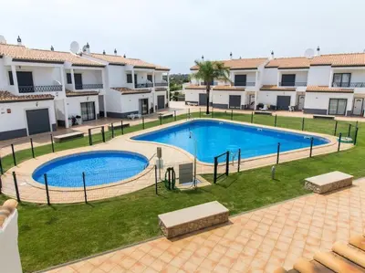 an image of a swimming pool in front of some buildings at Magnólia O House by Stay ici Algarve Holiday Rental in Albufeira