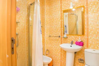 a bathroom with a sink and a shower and a toilet at Apartamento Studio Anastacio in Albufeira