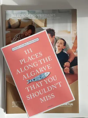 a book with a picture of a family at Quinta do Lago Golf, Sea & Sun in Quinta do Lago