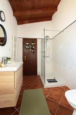 a bathroom with a shower and a sink at Cosy Farmhouse Quinta da Eira 140 years old in Loulé