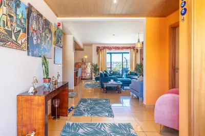 a living room with a couch and a table at Lovely LM Penthouse in Albufeira