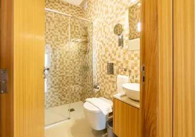 a bathroom with a toilet and a sink and a shower at Algarve Vale Lobo Golf&Beach with Private Pool I in Vale do Lobo