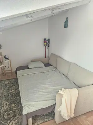 a living room with a couch and a bed at Casa Aventura in Boliqueime