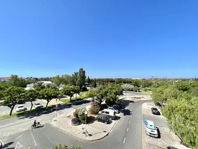 an aerial view of a parking lot with cars at Porto Marina - City center by HD PROPERTIES in Vilamoura