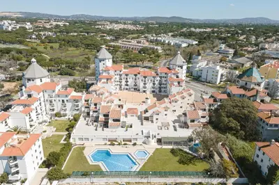 an aerial view of a large white building with red roofs at Porto Marina - City center by HD PROPERTIES in Vilamoura